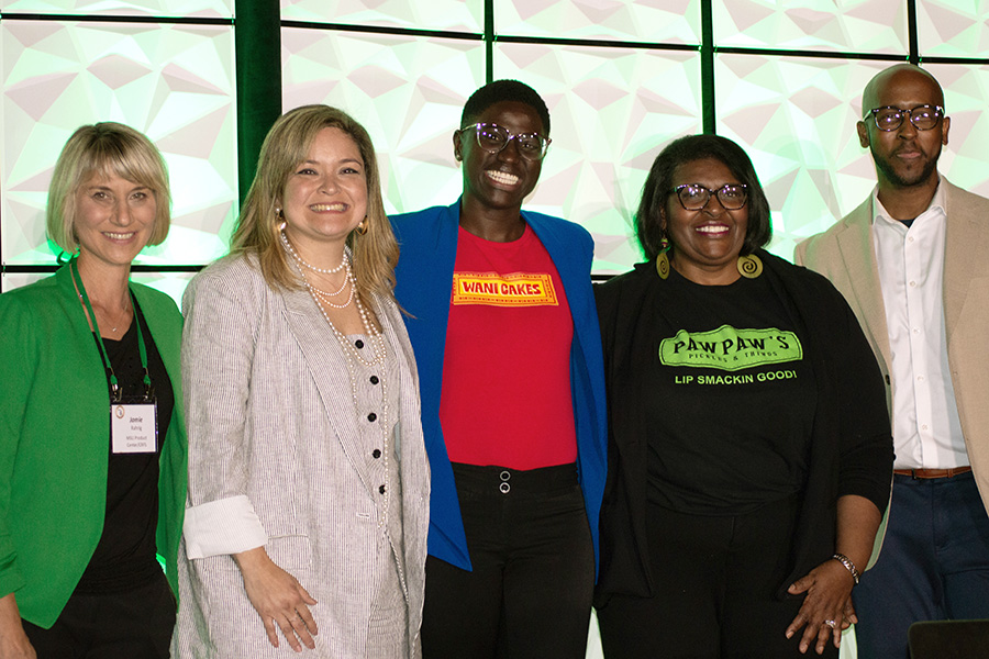 The pitch finalists stand with the co-hosts of 4th Annual Michigan Good Food Fund Pitch Competition. From left to right: Jamie Rahrig, Mariant Pena, Bola Okpue, Cynthia Hines, and Aaron Jackson.